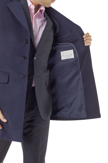 This custom overcoat makes an elegant, easily adaptable addition to any seasonal ensemble. Tailored with a comfortable slim fit, this three button piece features flap pockets, a soft shoulder, and notched lapels.