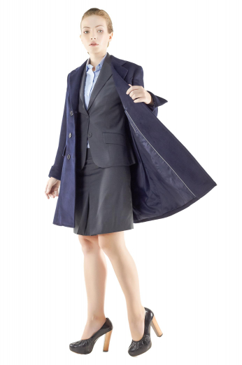 Knee length double breasted overcoats for winter season. Navy blue and handmade, these formal coats incorporate sleeves with folded cuffs, two lower flapped pockets and six front buttons, three to close. Can be worn with custom-made skirt suits for a stylish formal look.