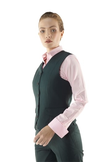 Beautifully hand sewn bespoke vests with angled V cut bottoms and five matching front buttons to close. These made to measure dark green V neck vests with handmade slanted flapped lower pockets look bewitching with matching custom pants and slim cut shirts.