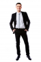 Young and Bold is what it’s all about for this mens suit custom tailored in black. A tailored suit with slim cut single breasted jacket and handmade low rise flat front pants - order it online to be custom made by our expert mens tailors. A suit to be proud of!