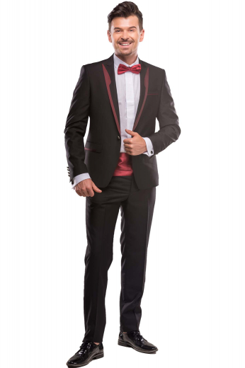 A custom tailored men's slim cut single breasted suit jacket with peak lapels with tailor made satin facings and a made to order center vent, paired with an elegant pair of bespoke slim fit flat front pants.
