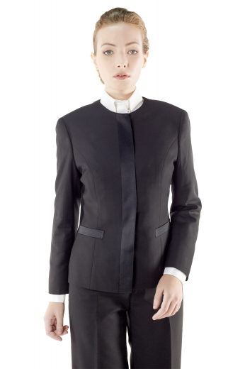 Style no.15912 - This super trendy womens handmade black tuxedo suit in wool - featuring a tailor made slim fit jacket and custom made baggy pants - gives a never-seen-before kind of formal look. The womens tailor made suit pants have a flat front, 2 on-seam front pockets, 2 beautifully hand sewn cuffs hems at the bottom, a zipper fly, and a 2 point button and hook closure. The womens bespoke tuxedo jacket is a show stealer with a princess dart front and back, 2 lower welt pockets, a rounded collar, and 5 front close buttons.