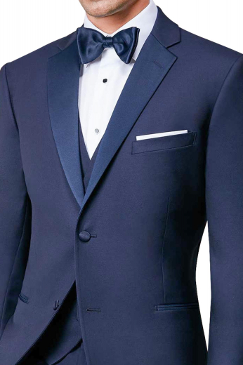 Mens handmade navy blue tuxedo suit in superwool. Features a mens bespoke slim fit tux jacket and mens custom made suit pants with a zipper fly for front closure. The mens tailor made dinner jacket has a single breasted pattern with 1 fabric covered front close button, 2 satin-facing notch lapels, 1 upper welt pocket, and 2 double piped lower pockets. The mens handmade dress pants have 2 front slash pockets and 2 back pockets. Buy this mens bespoke two piece dinner suit at My Custom Tailor to stay stylish.