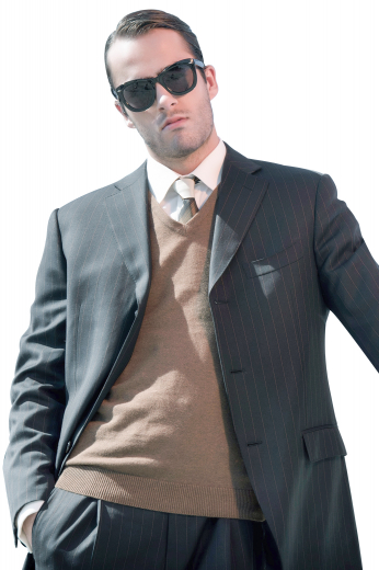 This stylish mens bespoke alpaca wool grey blazer with white vertical stripes is a perfect option for formal garments you can wear to work daily. It has a classy slim cut fit that looks even better with the incorporation of 3 front closure buttons and 2 notch lapels with a high gorge. With 2 lower flap pockets and 1 upper welt pocket, this single breasted mens custom blazer can also have hand stitched edges of the pockets and lapels.