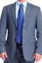 This sophisticated mens bespoke wool blazer available in the exciting and rare shade of dark greyish blue is for men who like simplicity as well as style. It features a stunning single breasted style that's augmented further with 2 front closure buttons and 2 1/2-inch-wide notch lapels. This made to order mens blazer is ideal for board meetings and other corporate events. Order online at My Custom Tailor where weavers deftly hand stitch it to flaunt 2 lower pockets with flaps and 1 upper welt pocket.