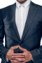This must buy mens handmade cashmere wool blazer in denim blue is an ideal golf jacket that also serves the purpose of an elegant mens bespoke blazer for meetings and interviews. It has a stylishly designed centre vent that makes it look a great deal more stunning in combination with the upper welt pocket and 2 lower flap pockets that it boasts on a slim cut fit. This made to order mens sports jacket in cashmere wool is a handsome single breasted formal, supported by a two button front closure for all day comfort.