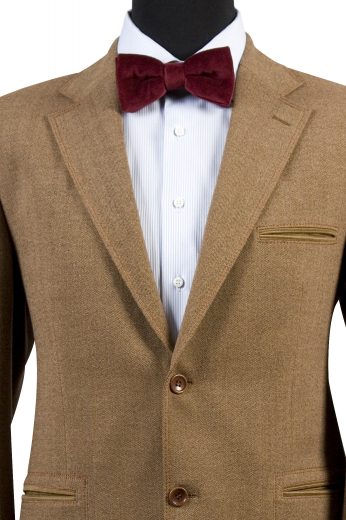 Say goodbye to the daily discomfort caused by regular formals by donning this mens bespoke tan wool blazer instead. It is an elegant sports jacket that puts to display a stunning slim cut fitting that looks more detailed with 2 buttons that close at front, 3-1/2-inch notch lapels, a centre vent, 1 double piped upper left pocket, and 2 double piped lower pockets. Weavers at My Custom Tailor can also design double track stitched lapels and pockets upon request.