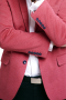 This is one luxuriously designed wool blazer for men that brings out an exciting shade of salmon. It is custom made to fit your needs and it sports an elegant upper welt pocket and two standard lower pockets with flaps. Neat columns of notch lapels and a slim-fit cut are enough to bring out that extra elegance that all men possess. It can also be handmade to feature edge stitched lapels and pockets for added sense of sophistication that will make you look every bit professional and classy.  