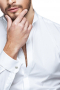 This men's slim cut tailored white button down features an ainsley collar, placket front, and rounded barrel cuffs and is made in a fine wool blend. 