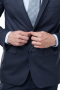 This classic men's pant suit is tailor made in a fine wool blend and cut in a slim fit, featuring satin notch lapels, single breasted button closures, and slash pockets. 