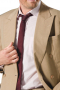 This khaki men's pant suit is tailor made in a fine wool blend and cut to a slim cut, featuring slash pockets and a double breasted button closure. 