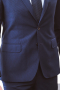 This men's pant suit is tailor made in a fine wool blend and cut to a slim fit, featuring slash pockets, notch lapels, and a single breasted button closure. It is a handsome option for all formal events!