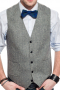 A stunning made to measure men's light grey slim cut vest is tailor made in a wool blend, featuring a single breasted closure and adjustable back buckle.