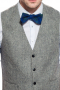 A stunning made to measure men's light grey slim cut vest is tailor made in a wool blend, featuring a single breasted closure and adjustable back buckle.