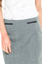 This women's pencil skirt is carefully made to measure in an exquisite wool blend, hitting just above the knee and featuring a center back vent.