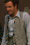 In a custom grey beige is this men's hand-tailored vest with a flattering classic neckline and fit. This bespoke-made vest has a stunning faint plaid pattern that is sophistically muted for debonair class.