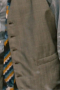 In a custom grey beige is this men's hand-tailored vest with a flattering classic neckline and fit. This bespoke-made vest has a stunning faint plaid pattern that is sophistically muted for debonair class.