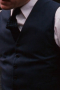 A great buy for any man is this highly flattering bespoke vest in a classically sophisticated navy that gives serves well as this custom single breasted vest perfectly blends vintage and modern sophistication.