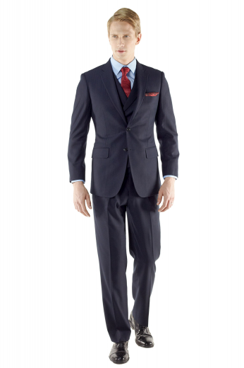 This custom made suit features a slim cut, versatile two button fit, flap pockets, notch lapel, and a lightly padded shoulder for a sharp, well-defined appeal with single small reverse pleat and urban styled three button double breasted waistcoat.