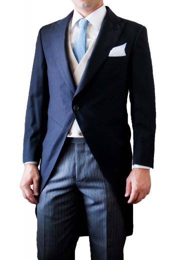 A made to measure single breasted one button rolled peak lapel suit jacket with a high gorge, paired with matching navy flat front pants with an extended three-point closure waistband with side adjustable tabs.