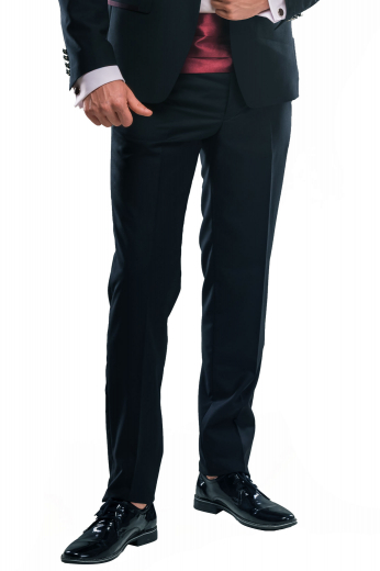 A pair of custom made slim cut flat front formal pants made elegantly by skilled tailors, these handmade midnight blue pants made out of a lightweight wool and cashmere blend. They feature made to order slash pockets and tailor made hand sewn cuff hems. 