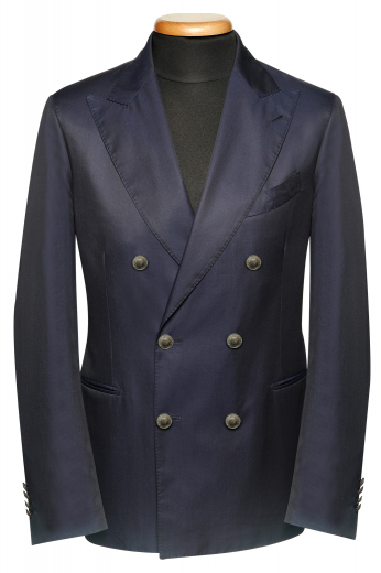 This men's black custom blazer is tailor made in a fine wool and cut to a slim fit, featuring double breasted button closure and piped pockets. 