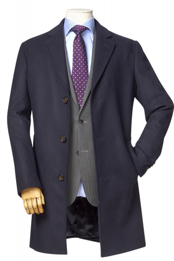 This men's black coat is a handsome fit for your winter needs! It is tailor made in a fine wool and tweed and cut to a slim fit, featuring a single breasted button closure and edge stitched lapels. 