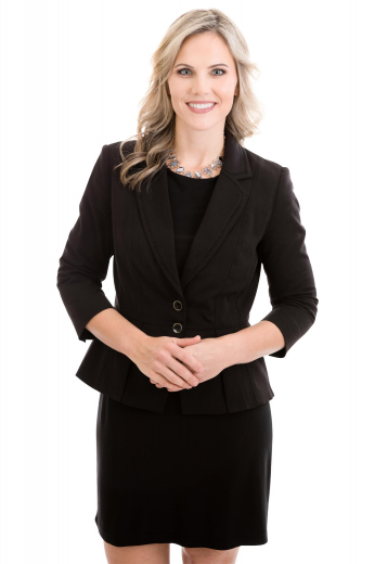 This modern black skirt suit will instantly elevate your office look and have you feeling incredibly confident. It is custom made with a single breasted blazer closure and a knee length skirt.