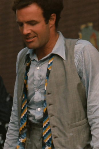 In a custom grey beige is this men's hand-tailored vest with a flattering classic neckline and fit. This bespoke-made vest has a stunning faint plaid pattern that is sophistically muted for debonair class.