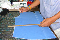 Our Master tailors hand mark and chalk the cloth for all our custom shirts